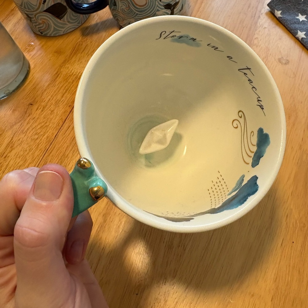 House of disaster storm in a teacup, teacup with gold foil accents